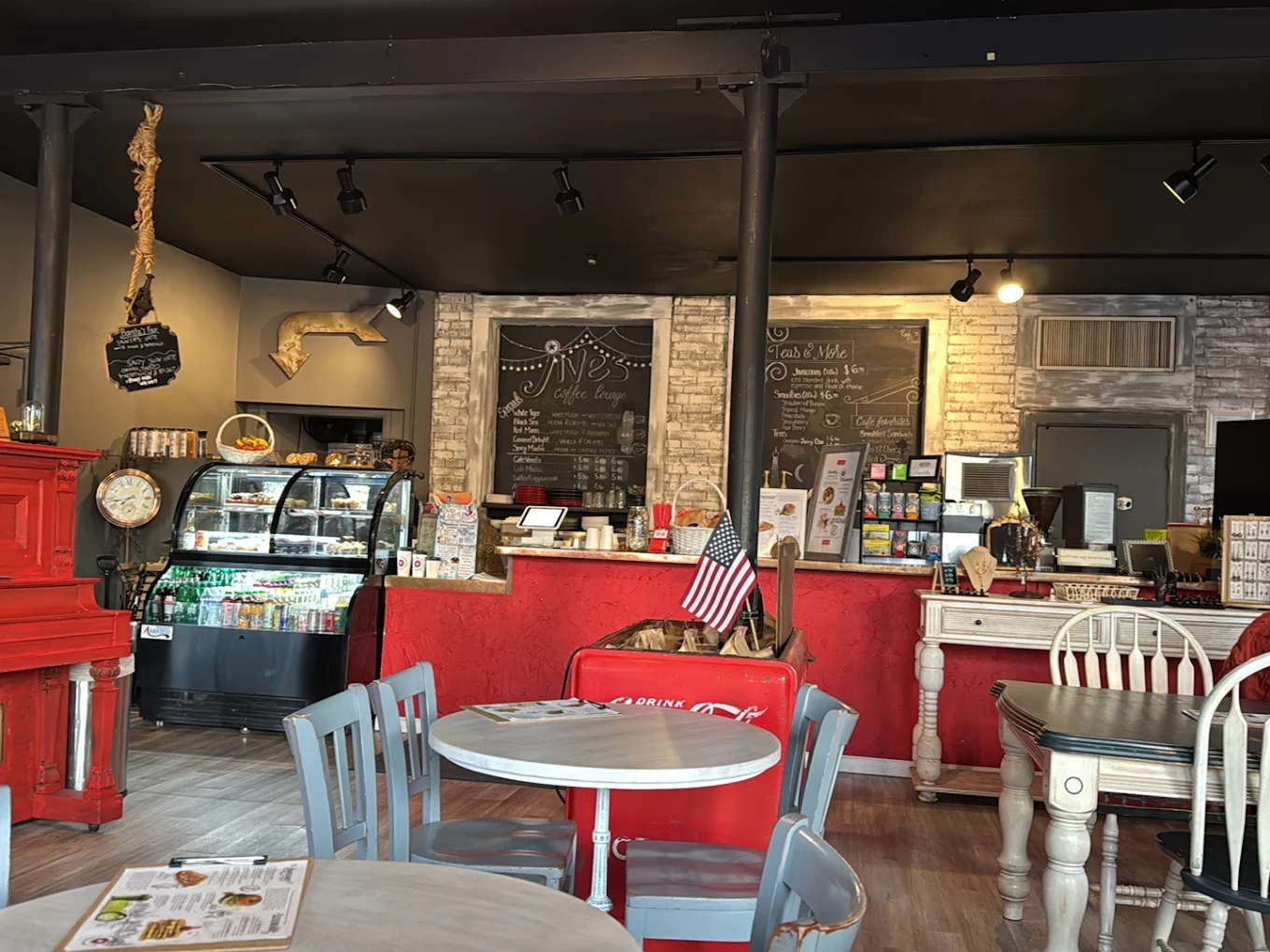 The Jives lounge interior with the red piano and the vintage Coca-Cola cooler